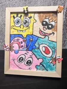 A SpongeBob-themed puzzle painting featuring vibrant colors and playful designs, crafted at Crafts Zone.