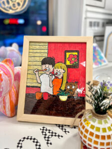 A creative puzzle painting project featuring colorful, interlocking puzzle pieces, crafted at Crafts Zone.