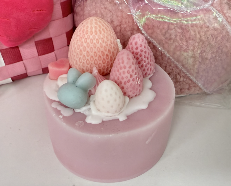 Colorful birthday cake candle with handcrafted design, showcasing creative DIY crafting.