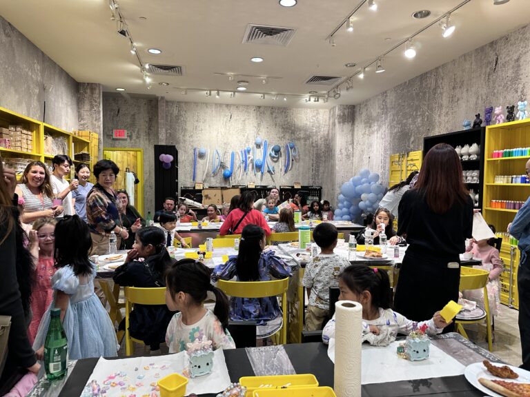 A lively kids' birthday party at Crafts Zone, where children and families enjoy hands-on crafting activities in a fun and creative space.