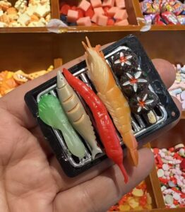 Miniature grilled seafood tray with shrimp, squid, and skewers