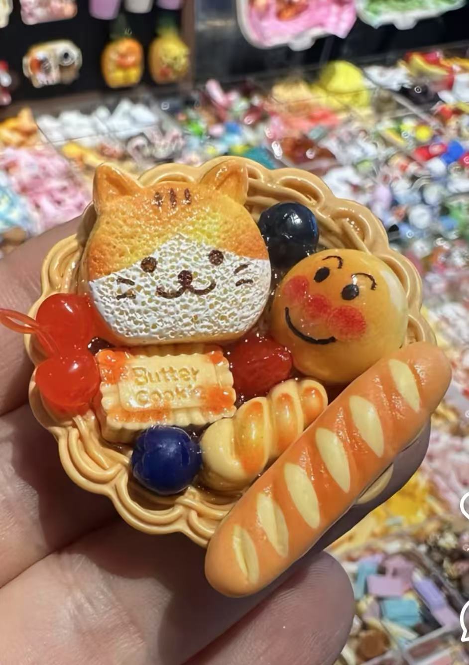 Miniature bread basket with cat-shaped cookie and smiling bun