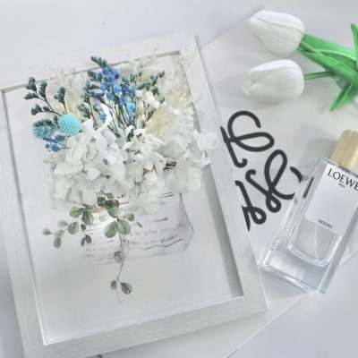 A handcrafted dry flower photo frame featuring delicate floral arrangements and elegant designs, created at Crafts Zone.