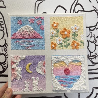 A textured painting created with sand and paint, featuring a 3D effect and intricate, raised patterns for a unique artistic look.