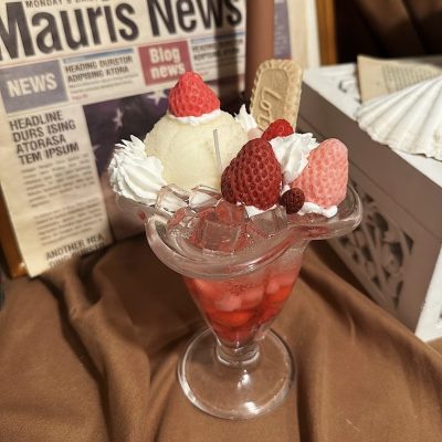 Dessert-inspired Martini Candle DIY with realistic ice cream, strawberries, and biscuit decorations.