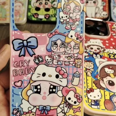 Cute "Cry Baby" themed phone case with Hello Kitty elements, cartoon characters, and pastel decorations.