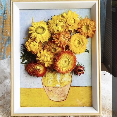A handcrafted dry flower photo frame decorated with preserved flowers arranged in a delicate and artistic design.