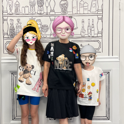 A family wearing custom DIY patch shirts featuring colorful and playful designs, showcasing creativity and personal expression